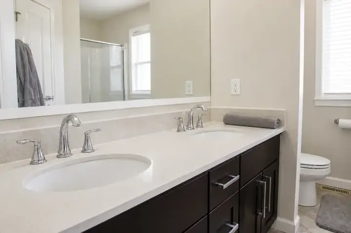 Same bathroom vanity after a Nest & Pine demo clean